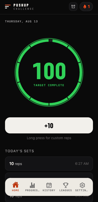 Home screen with the ring closed at 100 pushups, glowing green with the streak flame lit